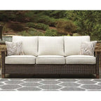 Signature Design by Ashley Paradise Trail Medium Brown/Beige Outdoor Sofa, Lounge Chairs and Fire Pit Table - 84W x 34D x 37H